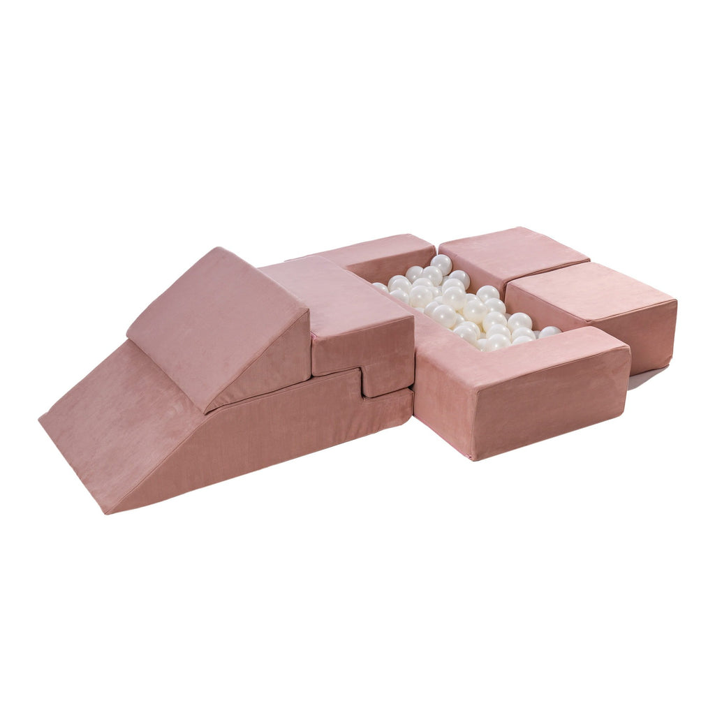 2. Pink velvet children's playground set configured as a ball pit with white balls