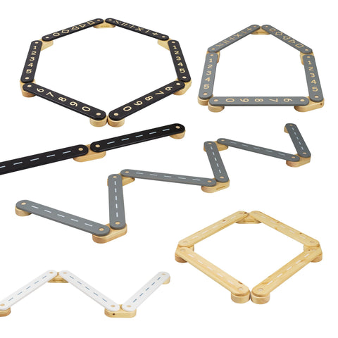 2. Various configurations of wooden balance beams in black, grey, and natural wood with numbers and road designs