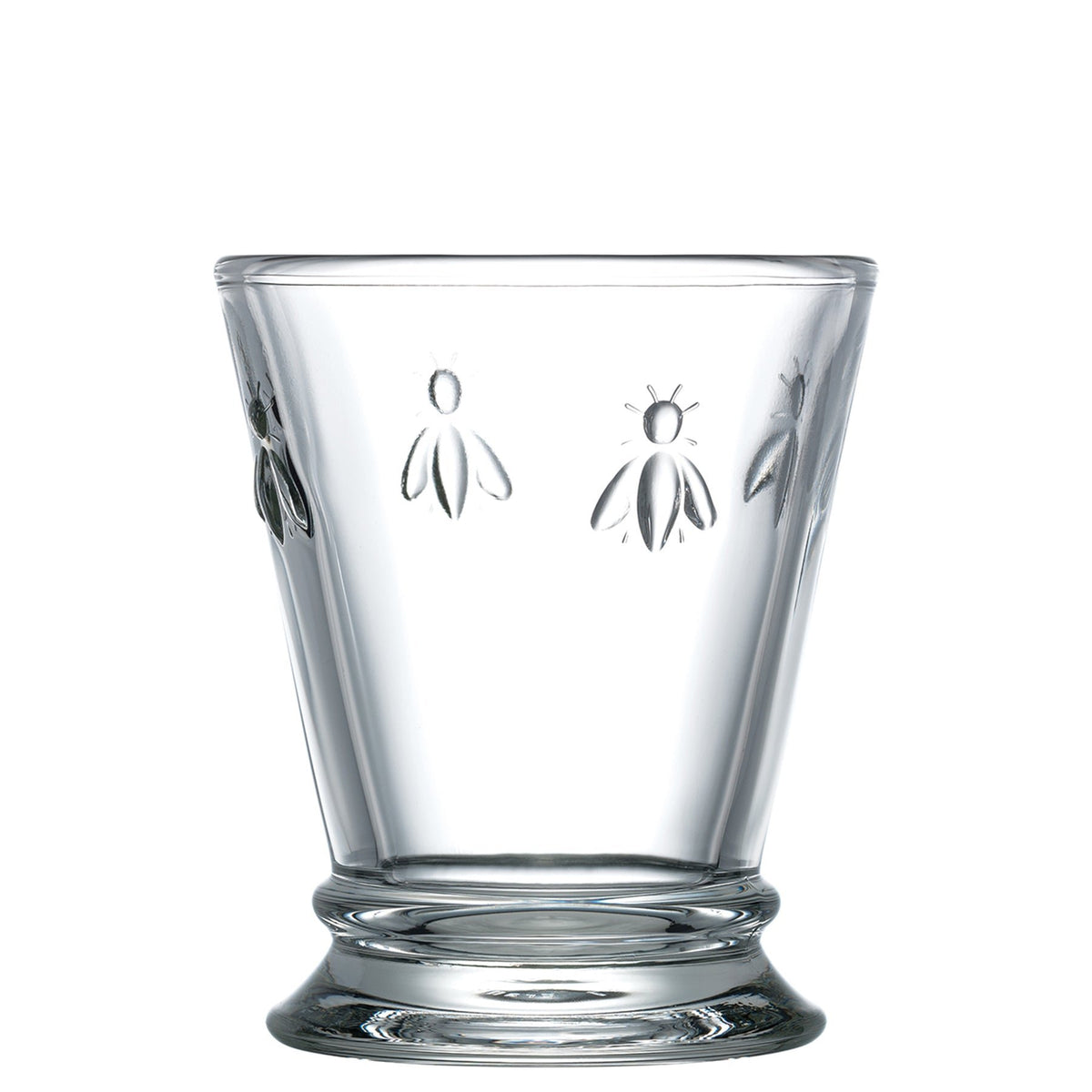 2. Studio shot of a single La Rochère Bee water glass with embossed bee motif on a white background