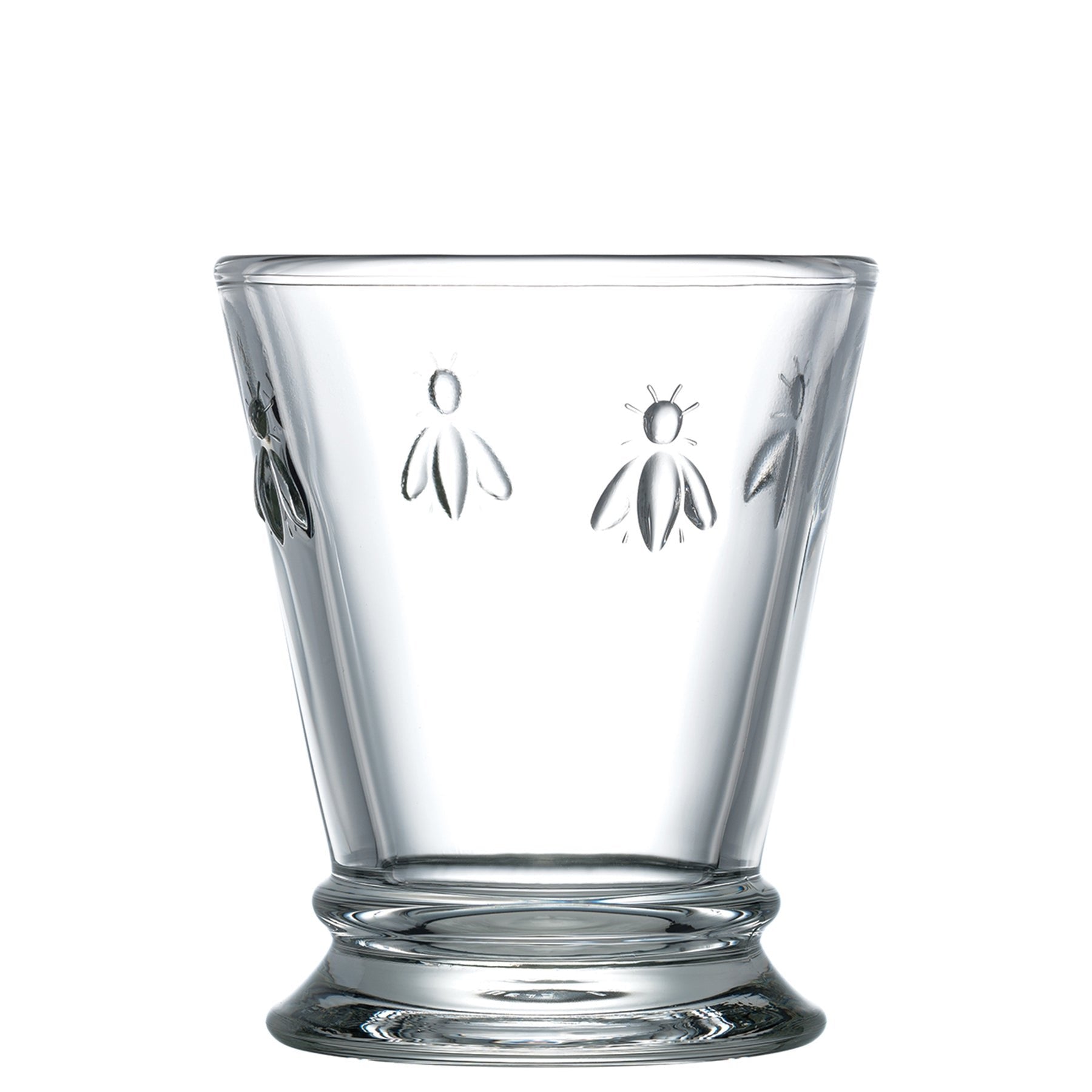 2. Studio shot of a single La Rochère Bee water glass with embossed bee motif on a white background