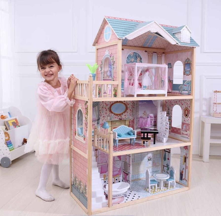 1. Young girl in pink dress playing with a three-story wooden dollhouse in a bright room