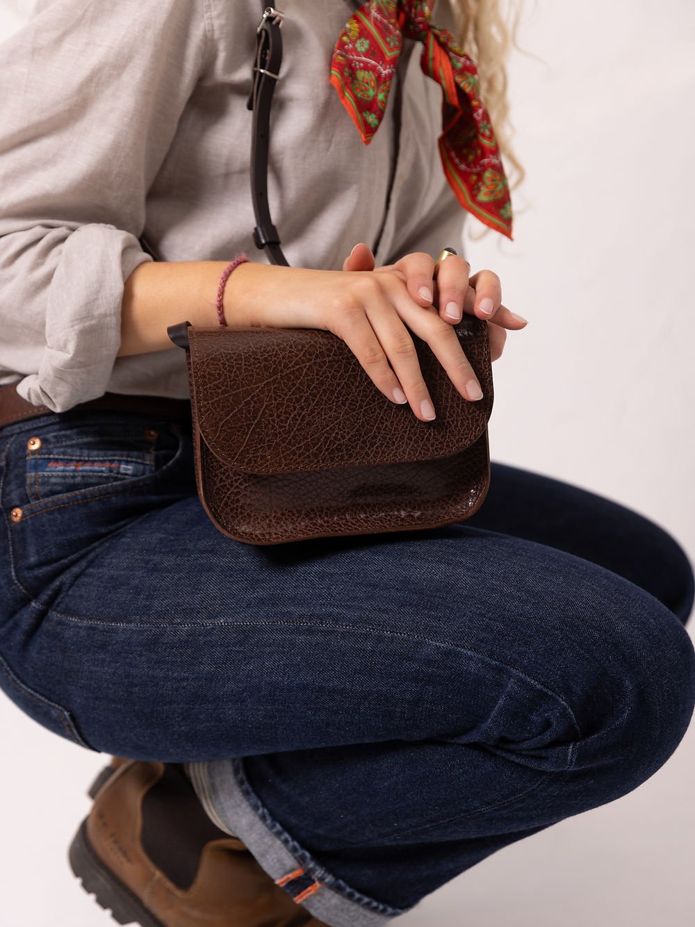4. Close-up of brown marble RUBY Purse by TOKS VISOKS, highlighting zipper detail