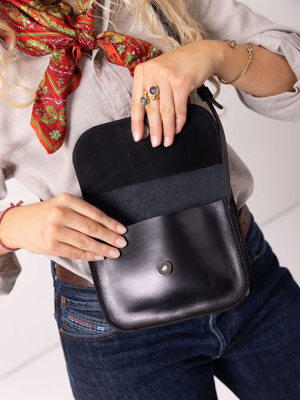 11. Close-up of black RUBY Purse by TOKS VISOKS with open flap, showing interior