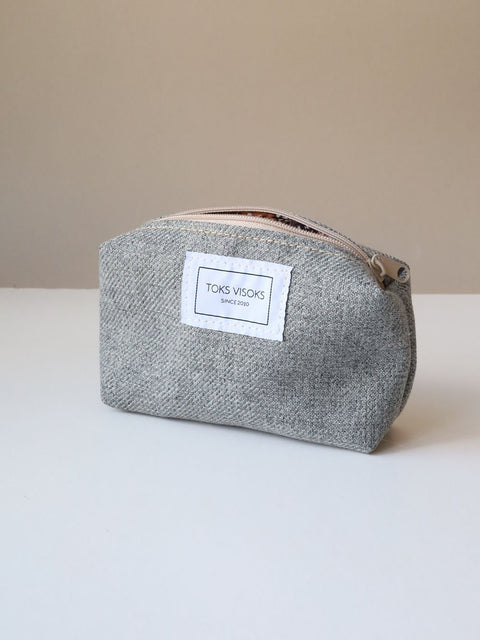 2. Studio shot of TOKS VISOKS LORNA grey makeup bag with visible brand label