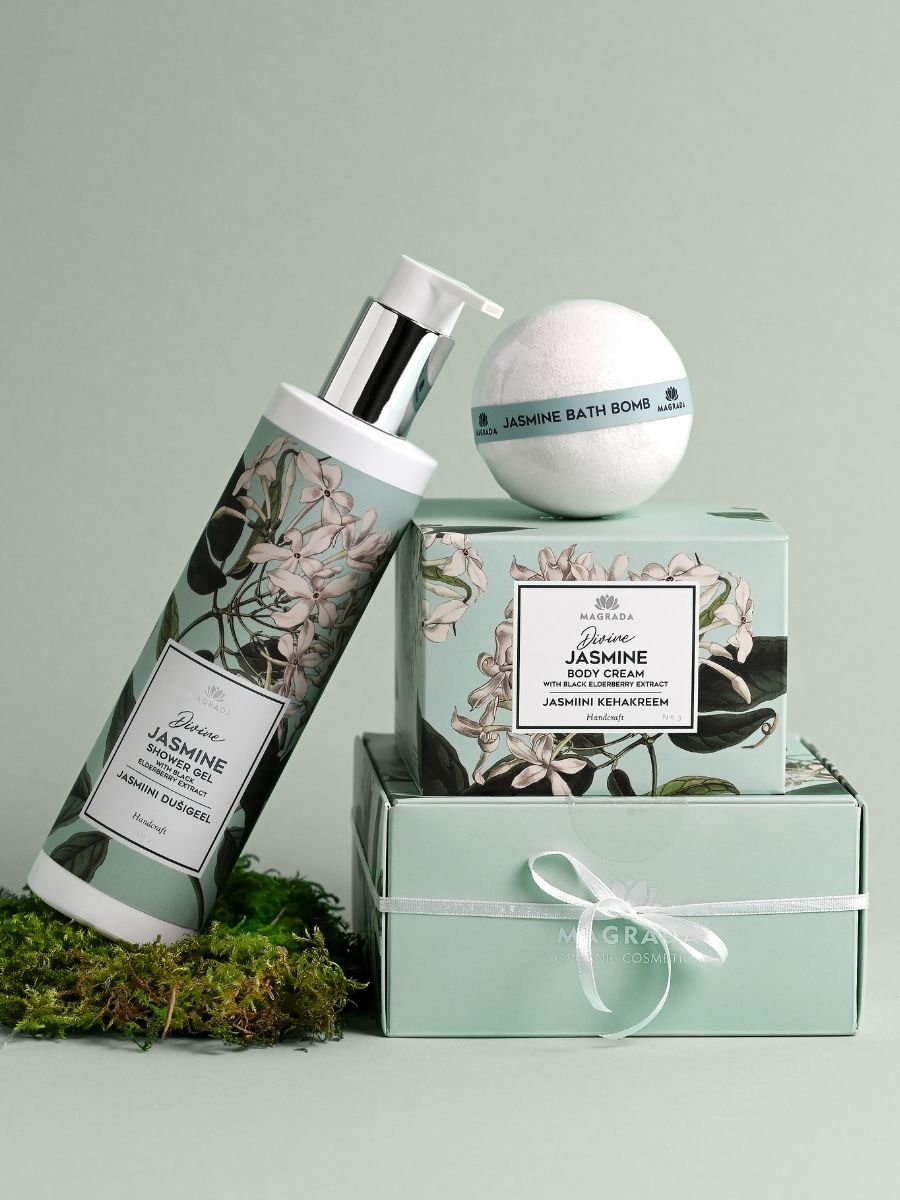 3. Magrada Jasmine Shower Gel, body cream, and bath bomb set, displayed with packaging on a green background