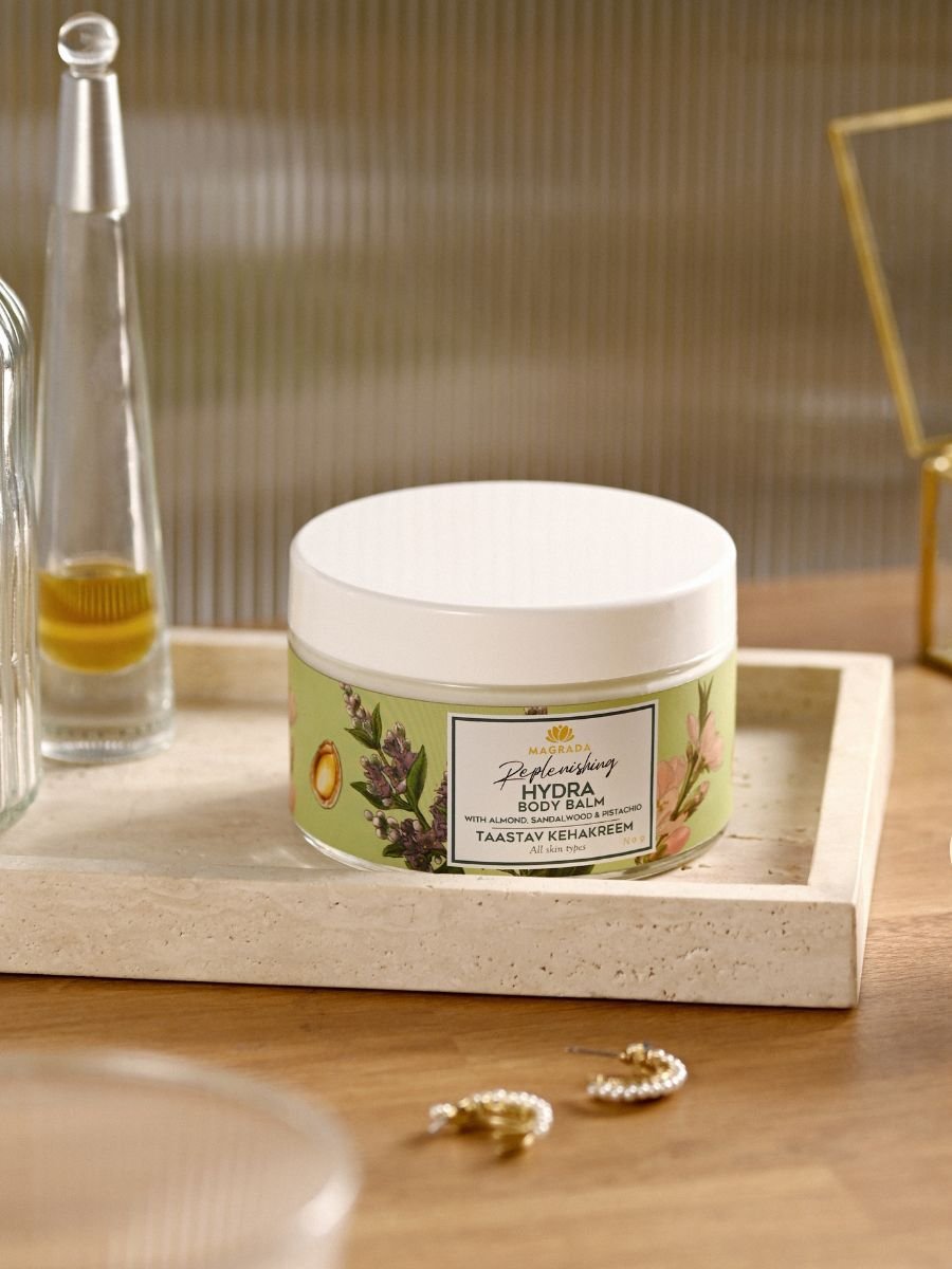 6. Magrada X Lauren Replenishing Body Balm on tray with decorative items in lifestyle setting