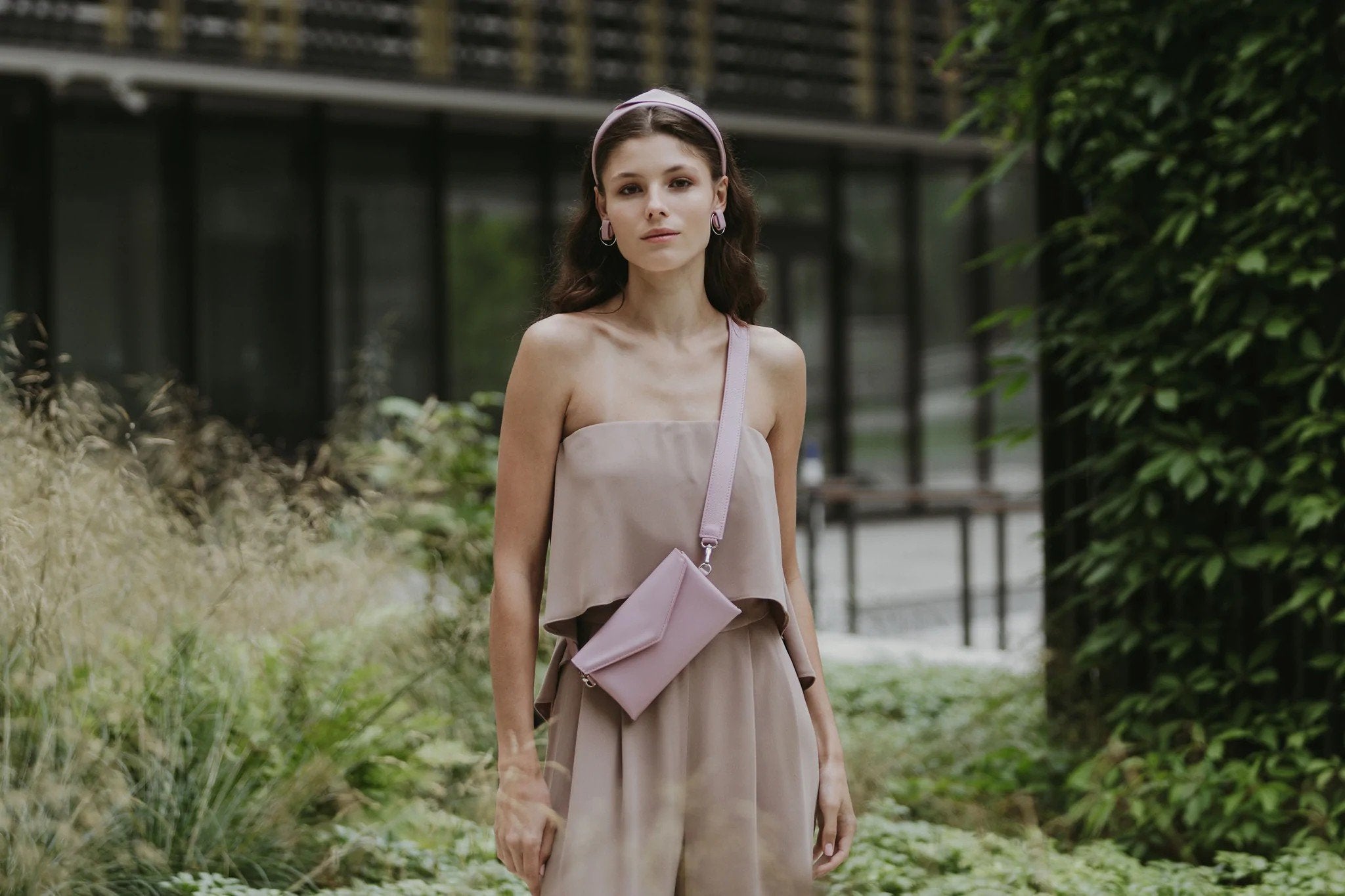 7. Women's brown leather waist and shoulder bag by Gerda Retter Design, worn with green dress