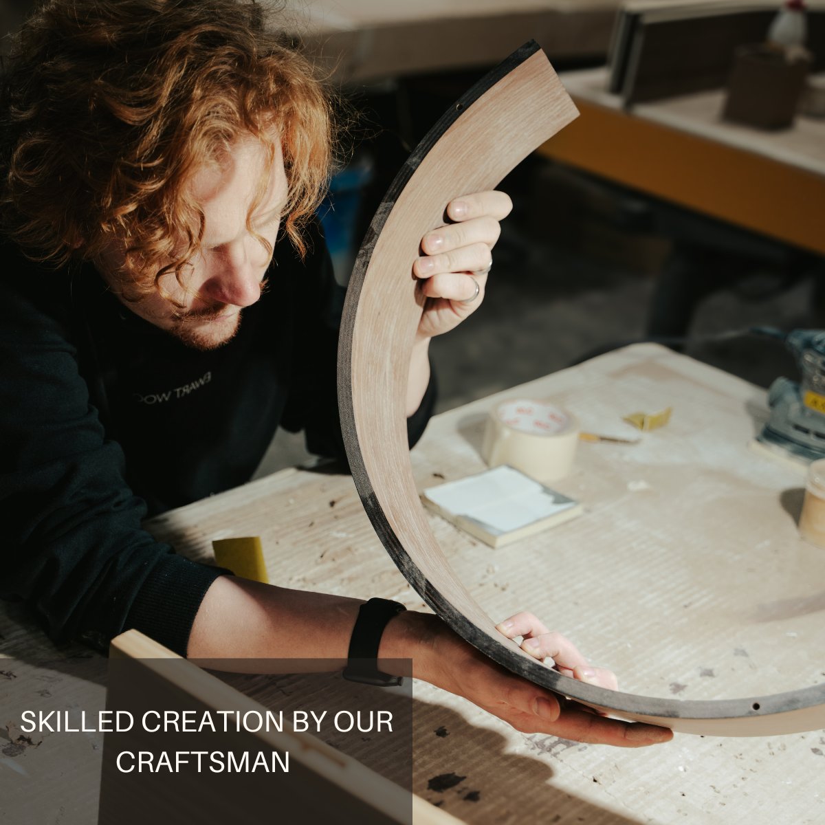 1. Craftsman working on handmade wooden toilet paper holder, showcasing skilled craftsmanship and attention to detail