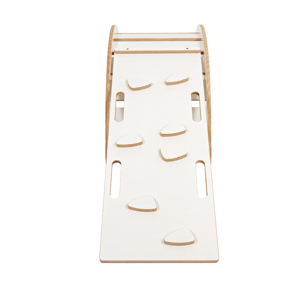 2. White wooden slide with climbing grips attached to rocker