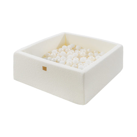1. MeowBaby white boucle square ball pit filled with white pearl balls, featuring soft anti-allergic foam and zippered washable cover, shown in a studio setting.