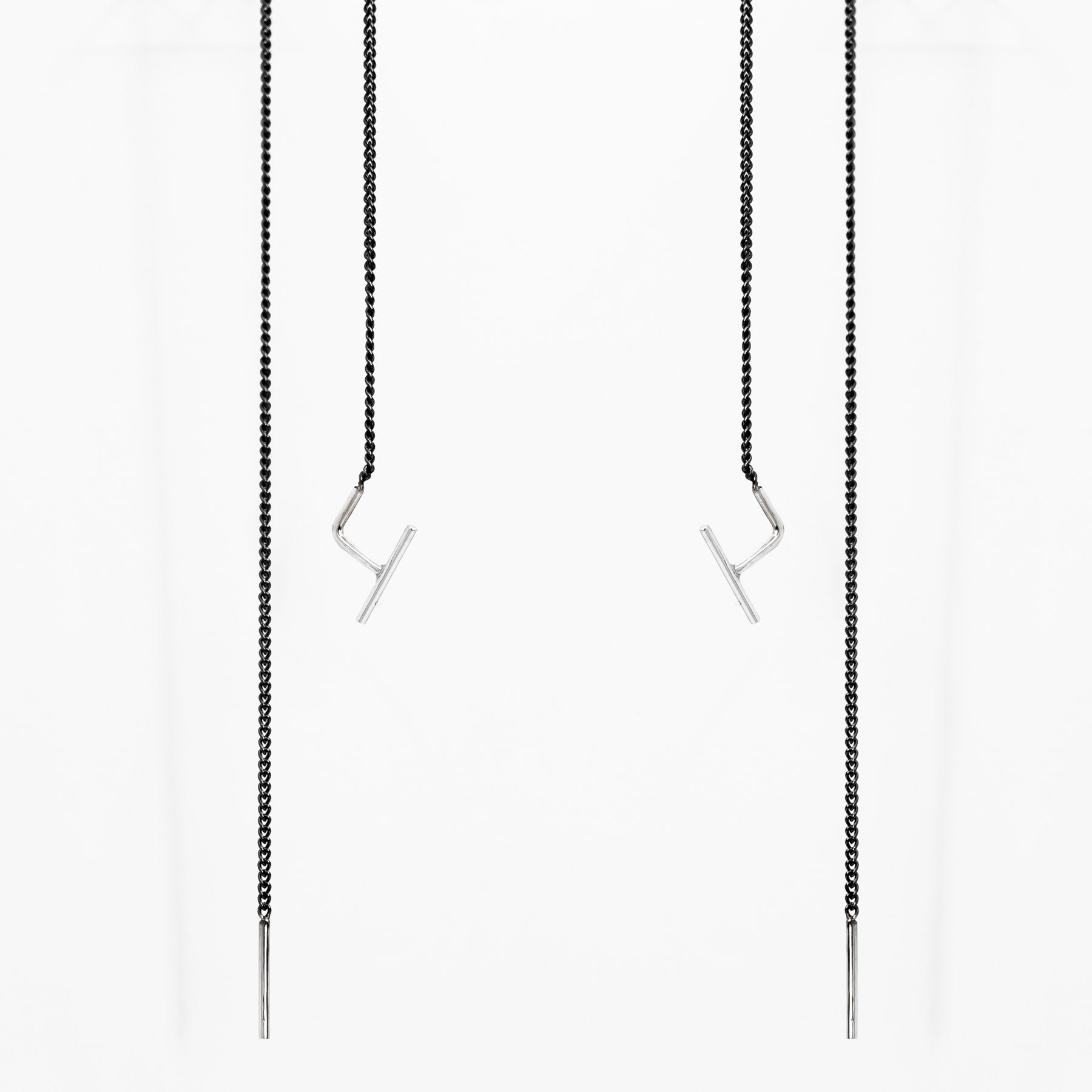 2. Studio image of Maarja Palu SWING 2 earrings with minimalist bar accents and oxidized silver chains