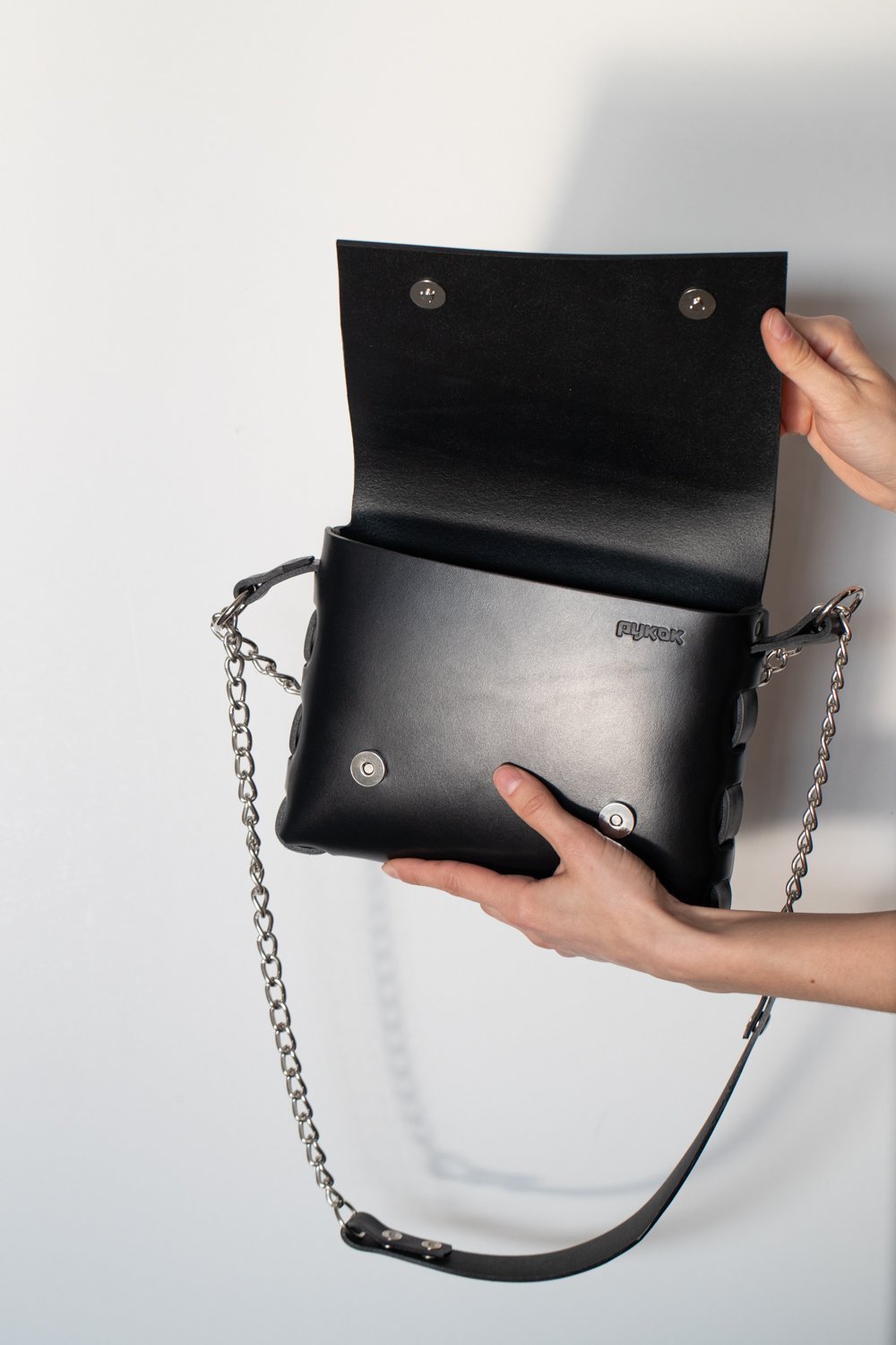 5. Close-up of open PYKOK Agatha no.3 handbag showing interior and chain strap