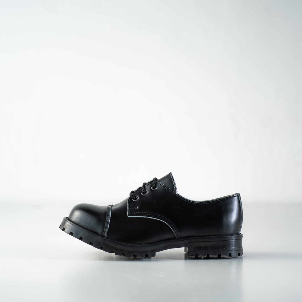 9. Studio image of unisex black Samelin Widgets, left side view