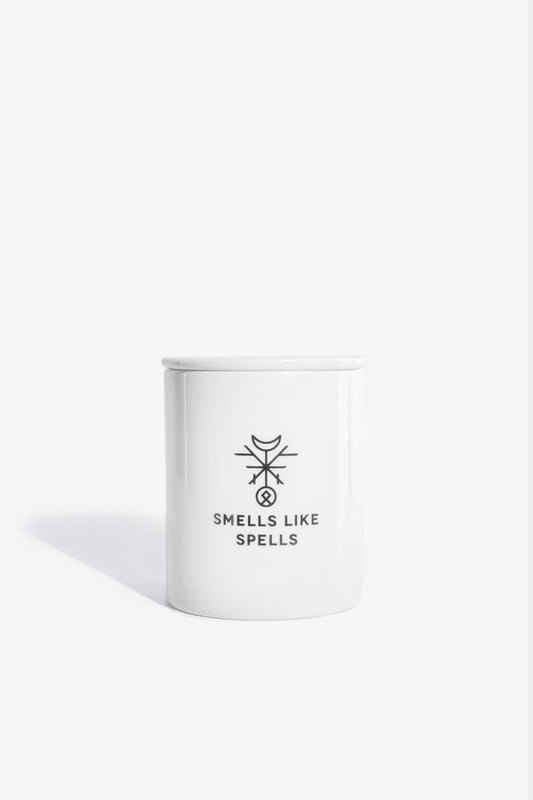 1. Smells Like Spells Scented Candle THE SUN in white porcelain container, studio setting