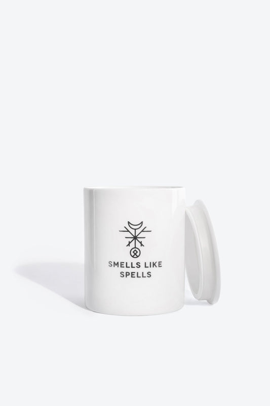 1. Smells Like Spells Scented Candle JUDGEMENT in white porcelain container with lid, studio setting