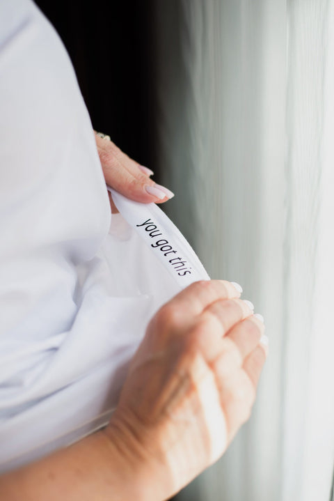 4. Close-up of hidden secret message 'you got this' inside women's Boobs T-Shirt by Black Giraffe Brand