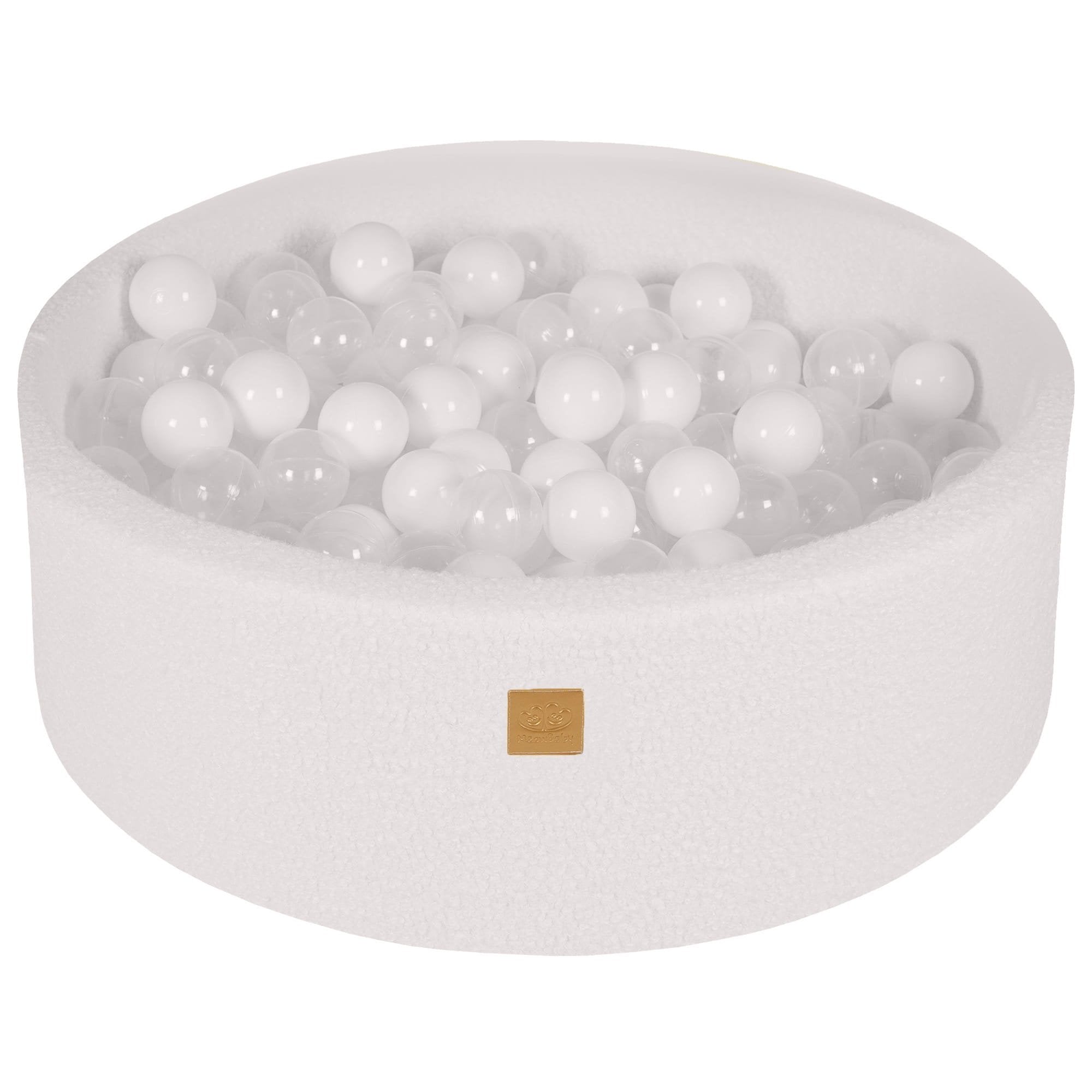 2. White boucle round ball pit filled with 200 white and transparent balls, featuring a soft hypoallergenic foam construction, ideal for children's sensory play and motor skill development.