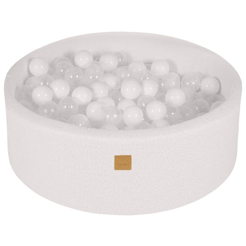 2. White boucle round ball pit filled with 200 white and transparent balls, featuring a soft hypoallergenic foam construction, ideal for children's sensory play and motor skill development.