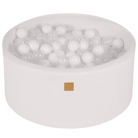 1. White boucle round ball pit filled with 300 white and transparent balls, featuring soft hypoallergenic foam and zippered cover, ideal for children's sensory play and motor skill development.