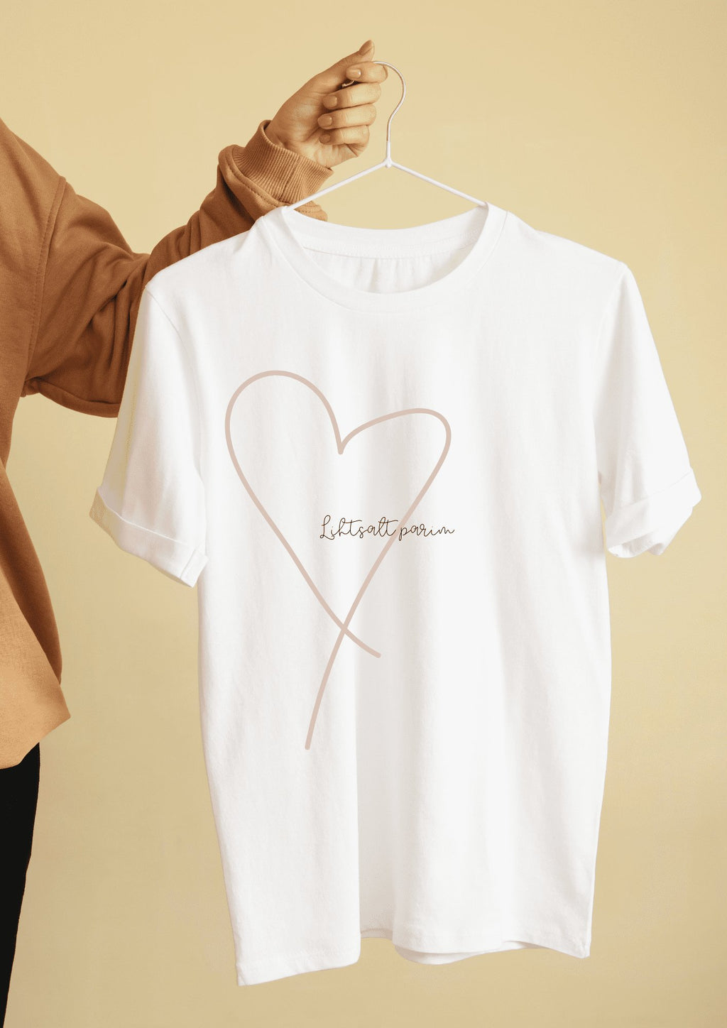 2. White T-shirt with heart design and 'Lihtsalt parim' text, displayed on hanger, by Black Giraffe Brand