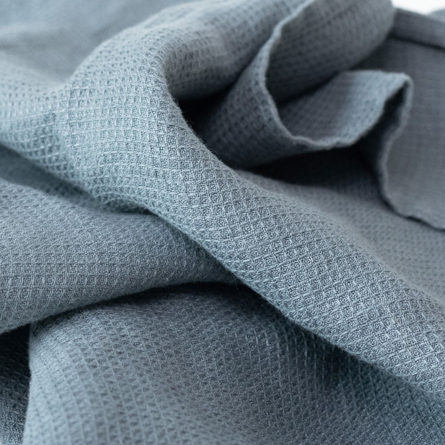5. Close-up of blue fog linen fine waffle towel texture highlighting intricate pattern