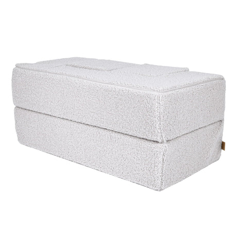 3. Side view of MeowBaby children's white foam sofa folded into a compact shape