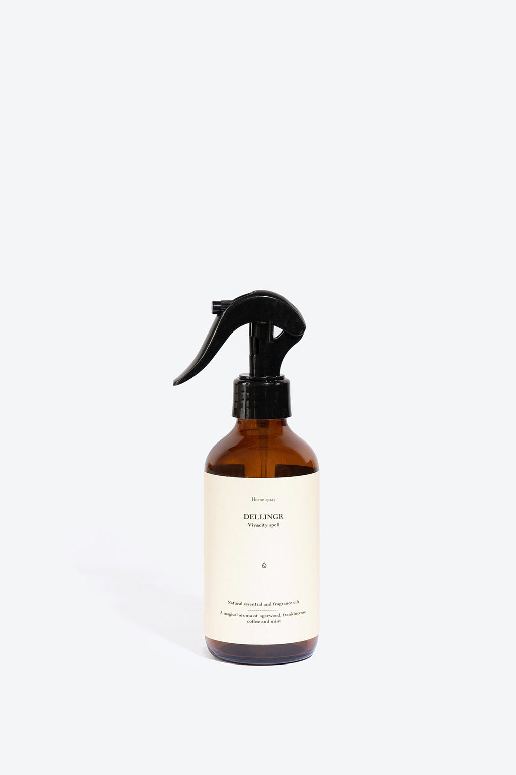 3. Smells Like Spells DELLINGR perfumed home spray in amber bottle, studio setting
