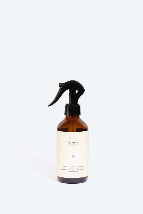 3. Smells Like Spells DELLINGR perfumed home spray in amber bottle, studio setting