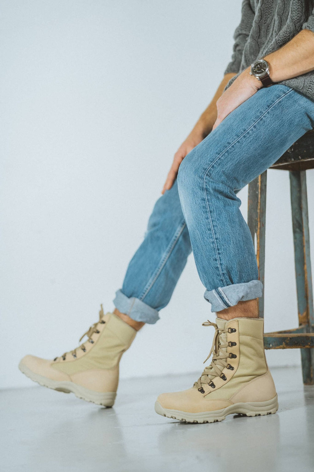 2. Close-up of men's beige Samelin 598 Desert Boots paired with rolled-up jeans