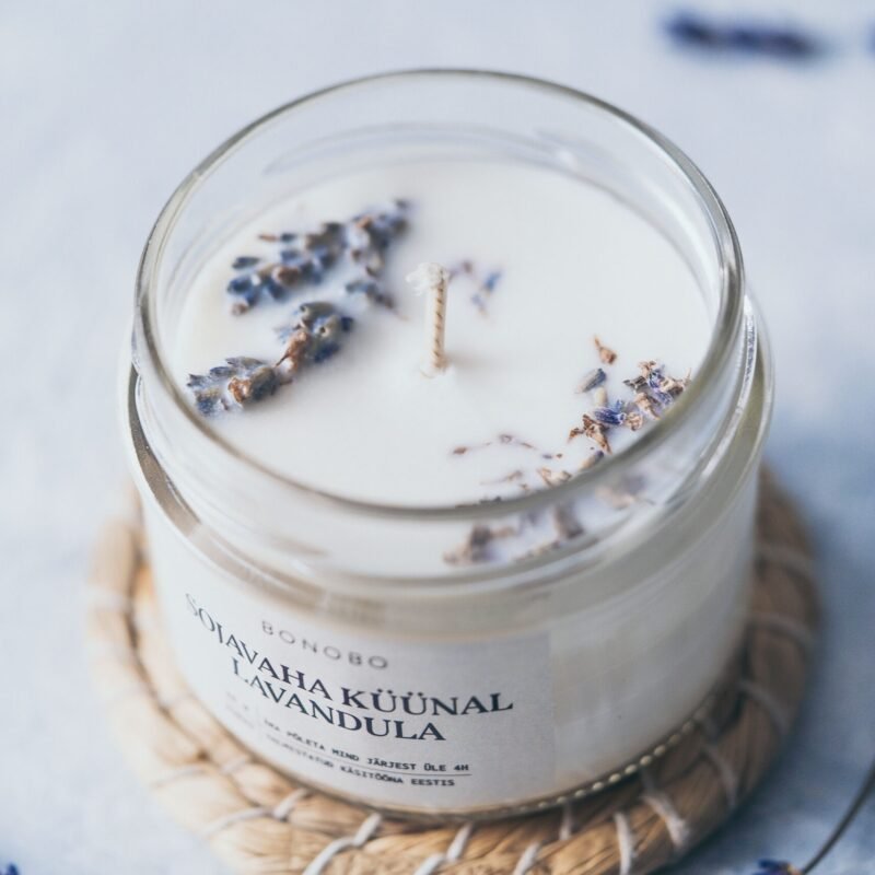 4. Close-up of Bonobo lavender scented candle with dried lavender, emphasizing natural ingredients