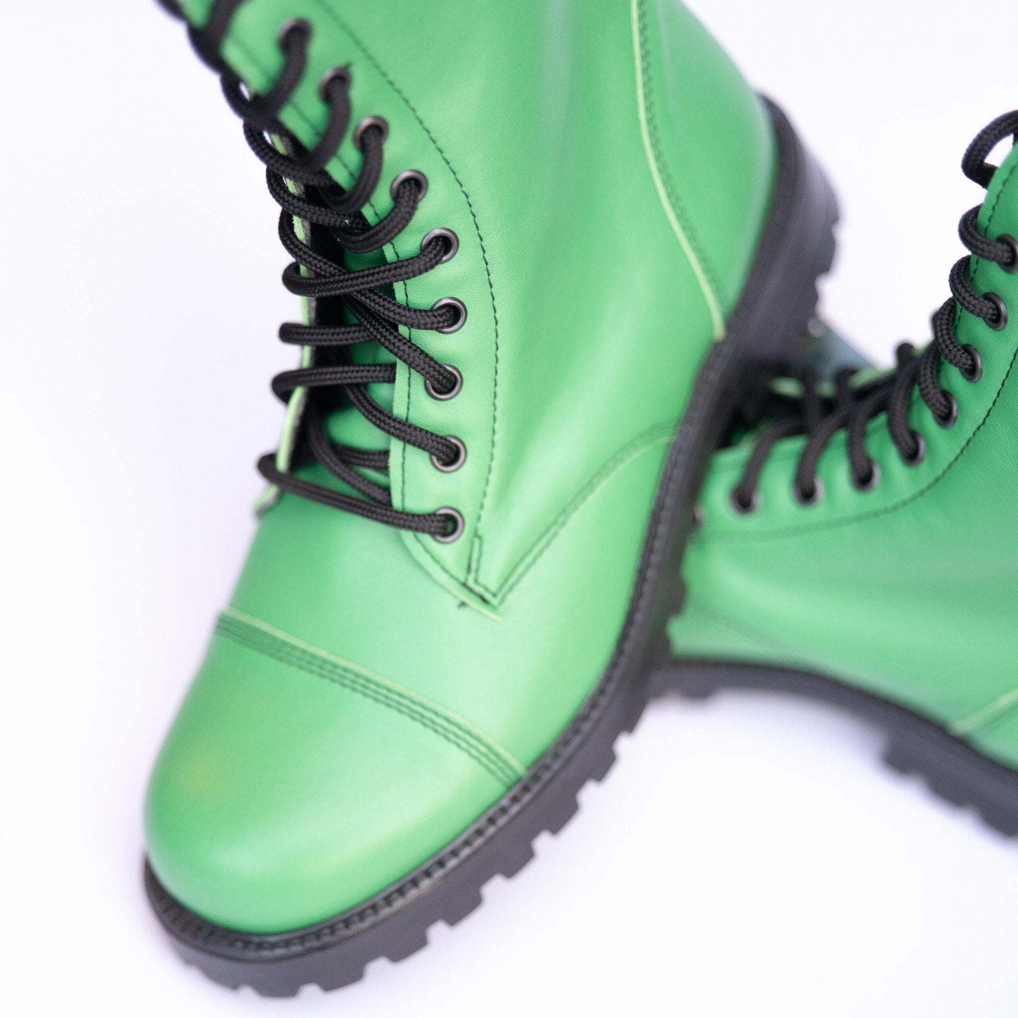 5. Close-up of green Samelin 511 Granny Smith boots, highlighting leather texture and laces