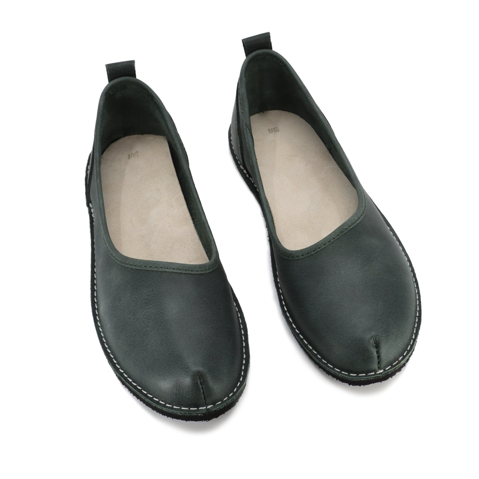 6. Studio shot of Omaking Kuutsid dark green shoes, showing top view with genuine leather upper