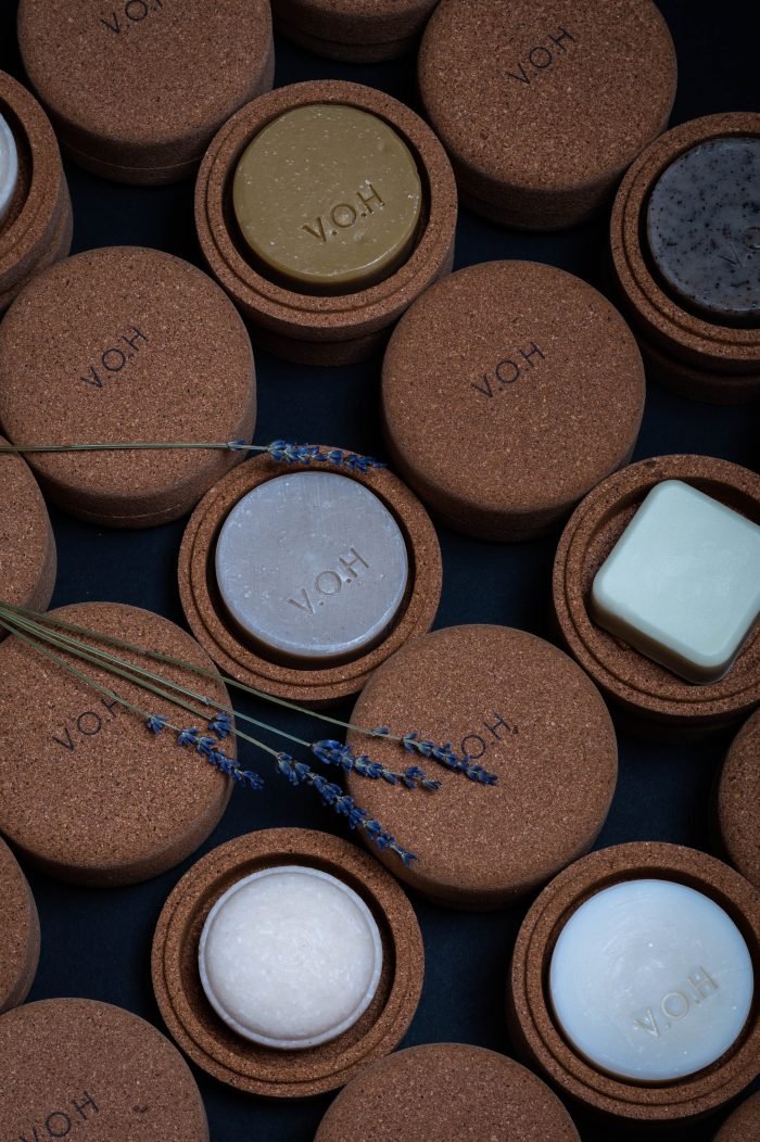 6. Assorted V.O.H solid hair-care products in corkwood cases, showcasing variety and sustainability