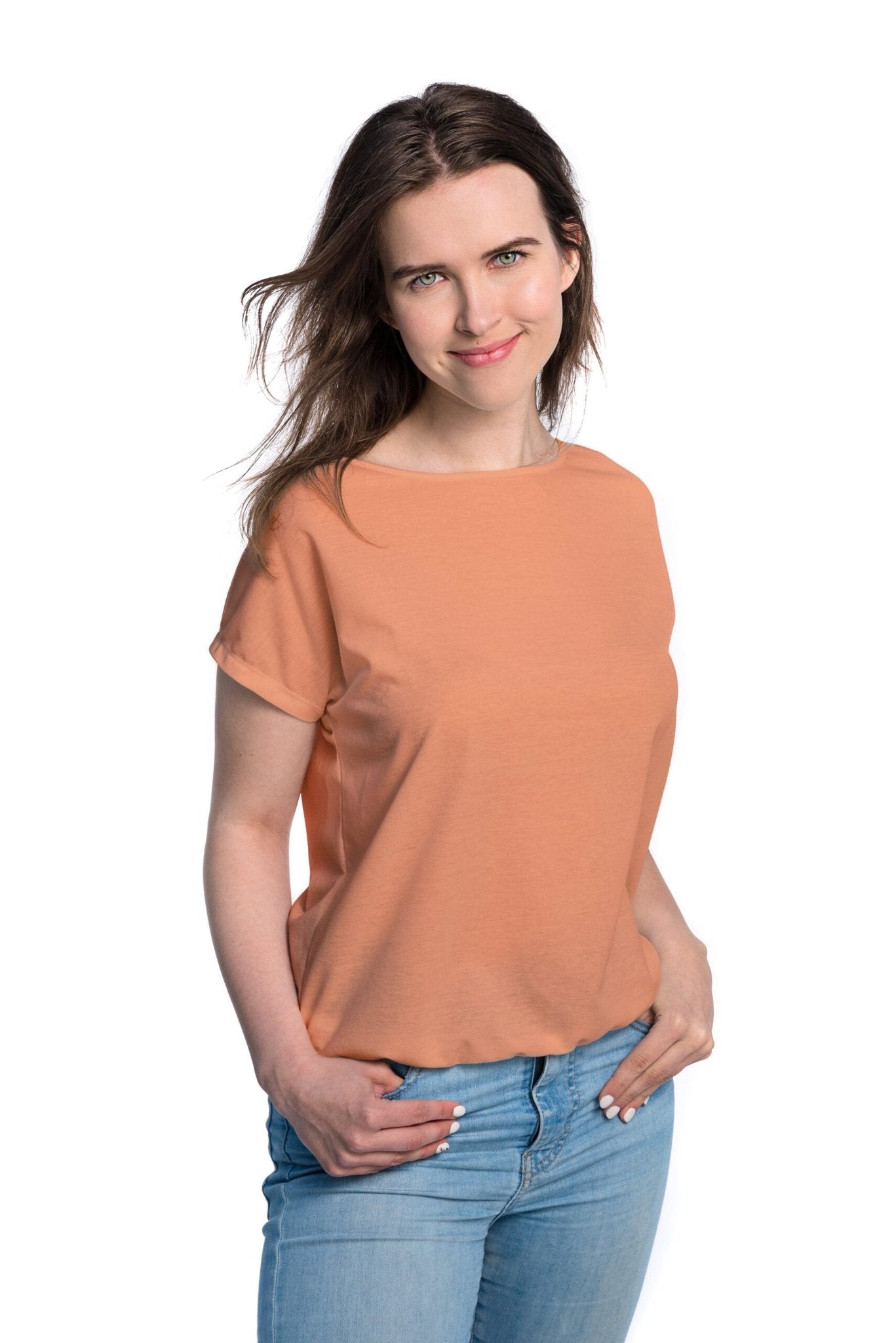 1. Women's tan-through t-shirt in terracotta by Smarttan, shown in studio setting