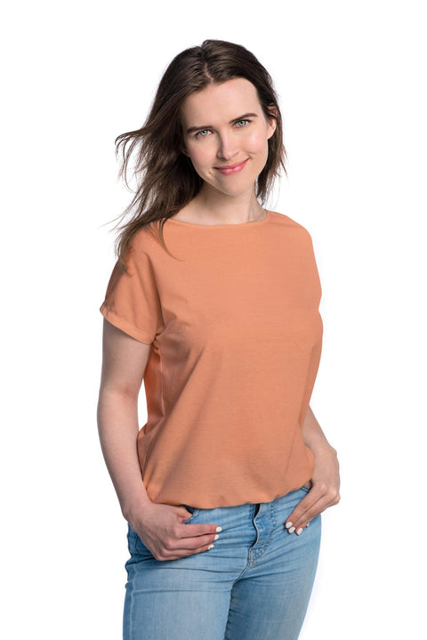 1. Women's tan-through t-shirt in terracotta by Smarttan, shown in studio setting