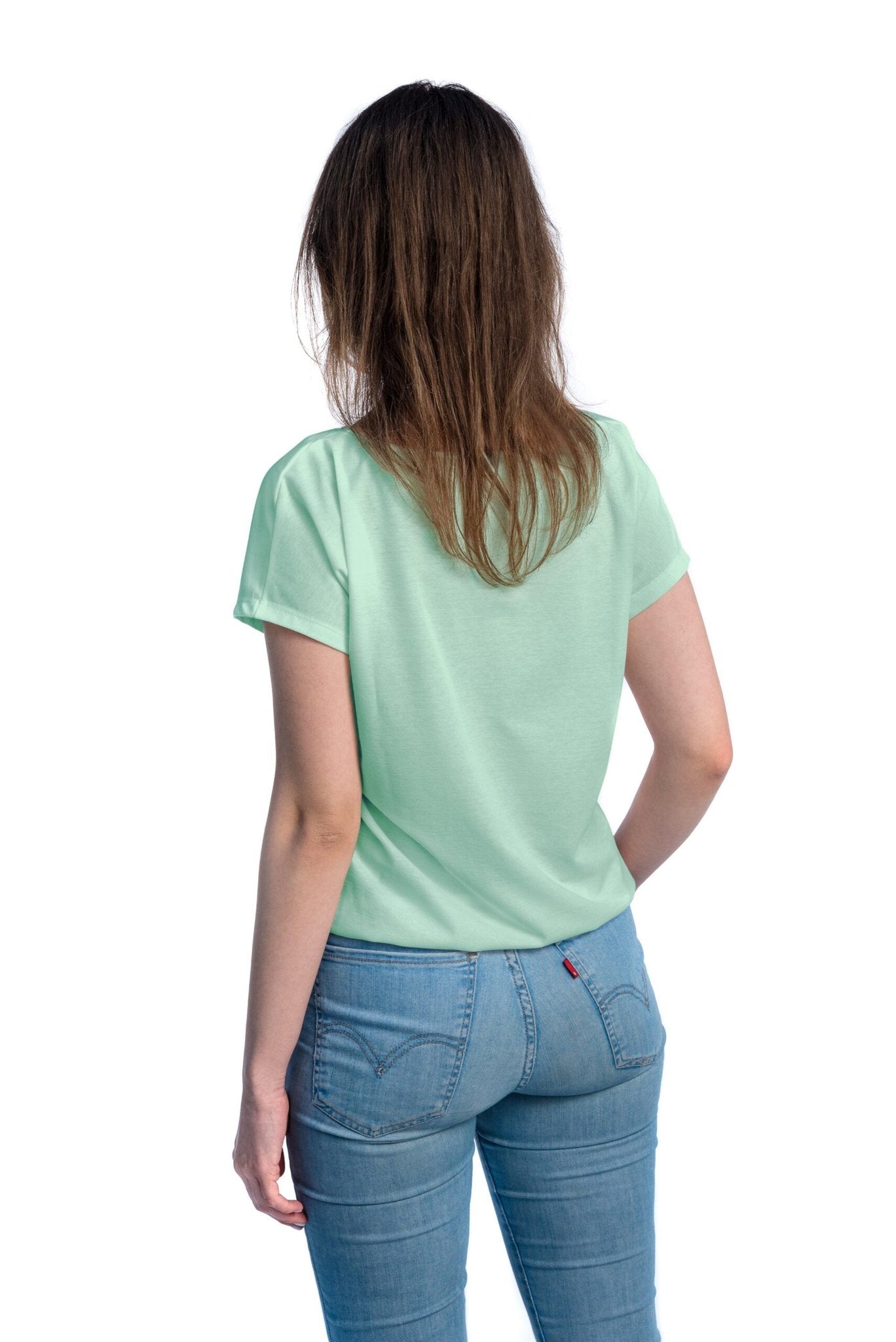 1. Women's tan-through t-shirt in mint green shown from the back, highlighting breathable design and elastic band