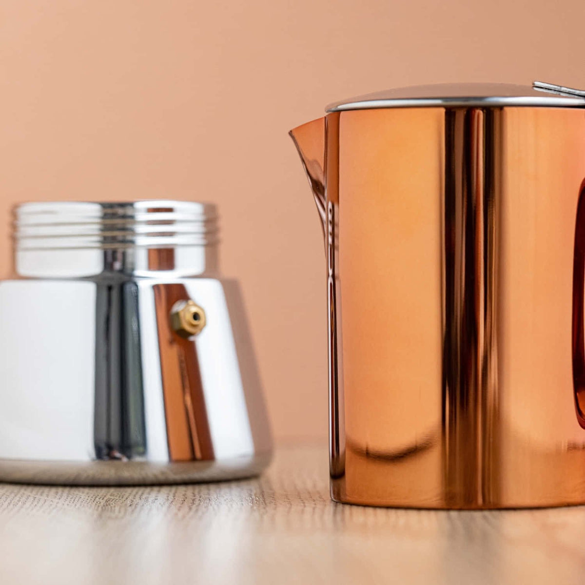 7. La Cafetière copper top and silver base separated on wooden surface