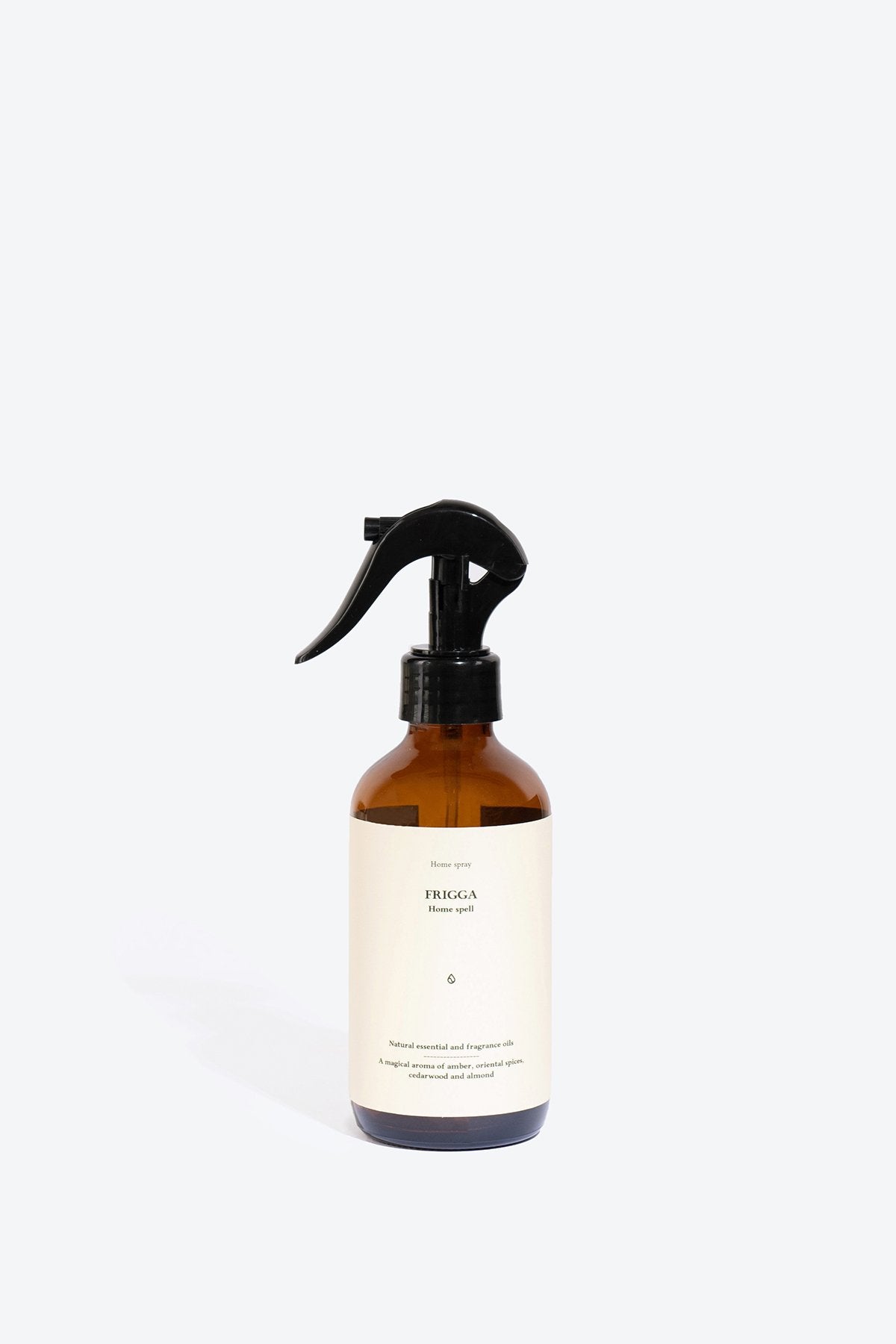 1. Smells Like Spells FRIGGA perfumed home spray in amber bottle, studio setting