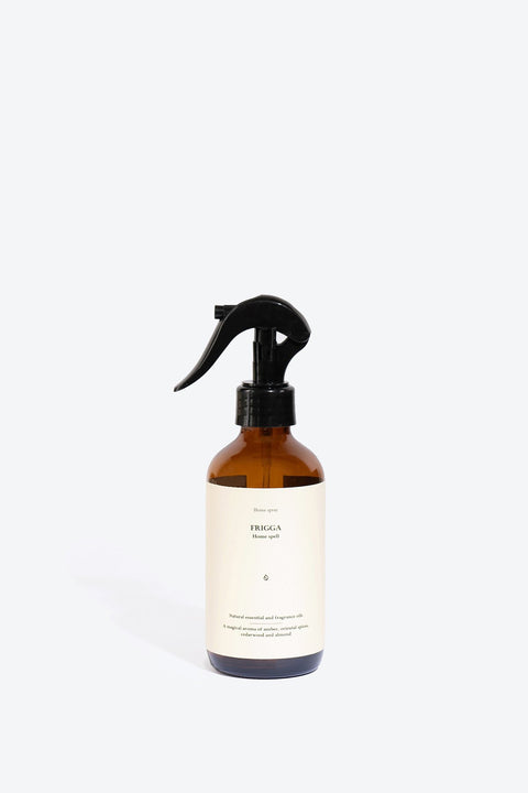 1. Smells Like Spells FRIGGA perfumed home spray in amber bottle, studio setting
