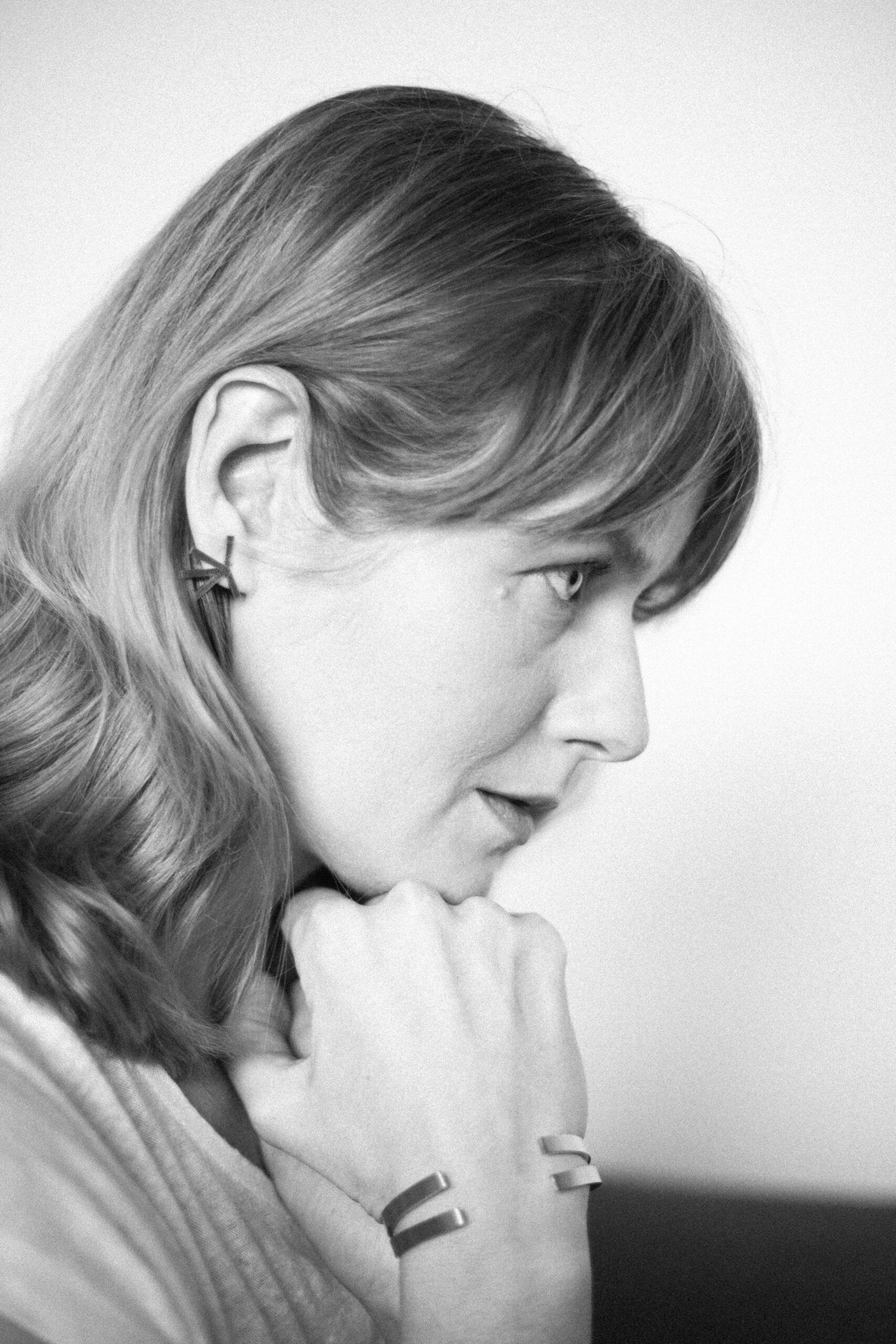 5. Profile of woman wearing Lentsius Stella earrings, highlighting handmade craftsmanship
