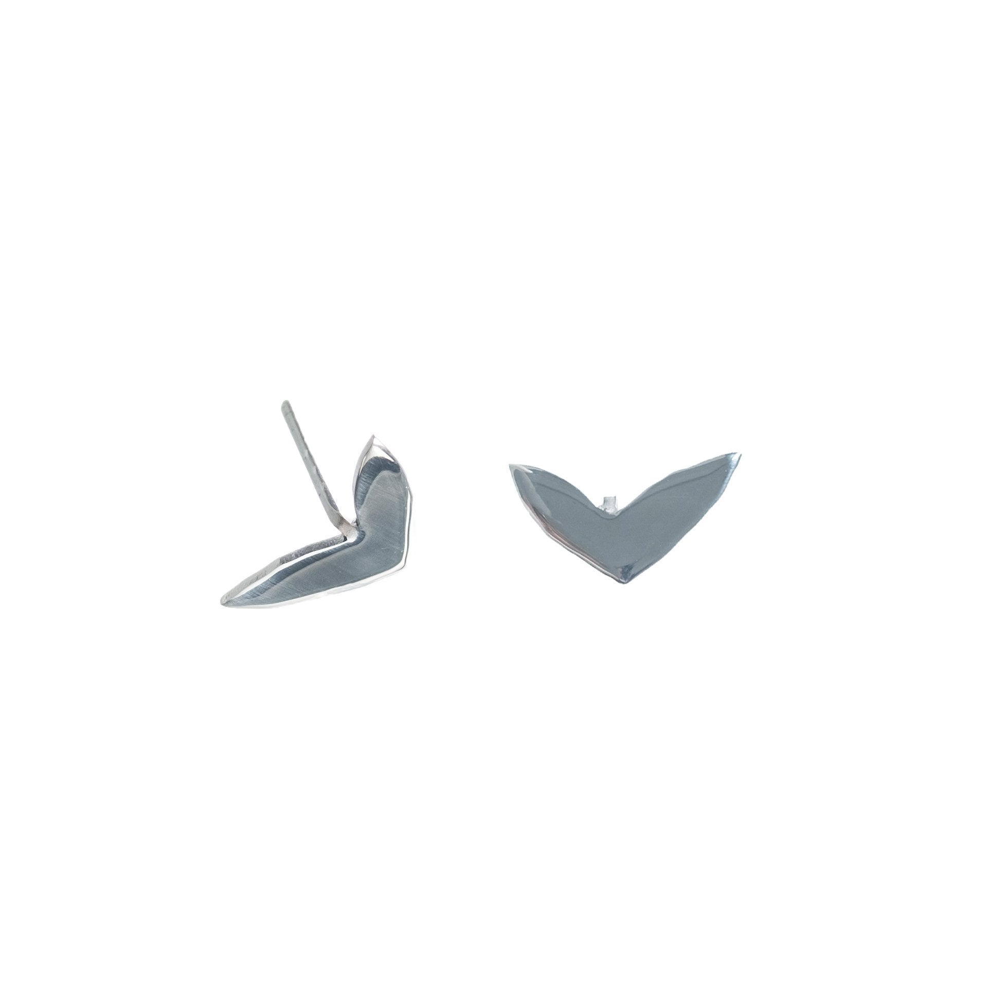 4. Studio image of Lentsius Vola silver earrings, highlighting unique shape and polished stainless steel