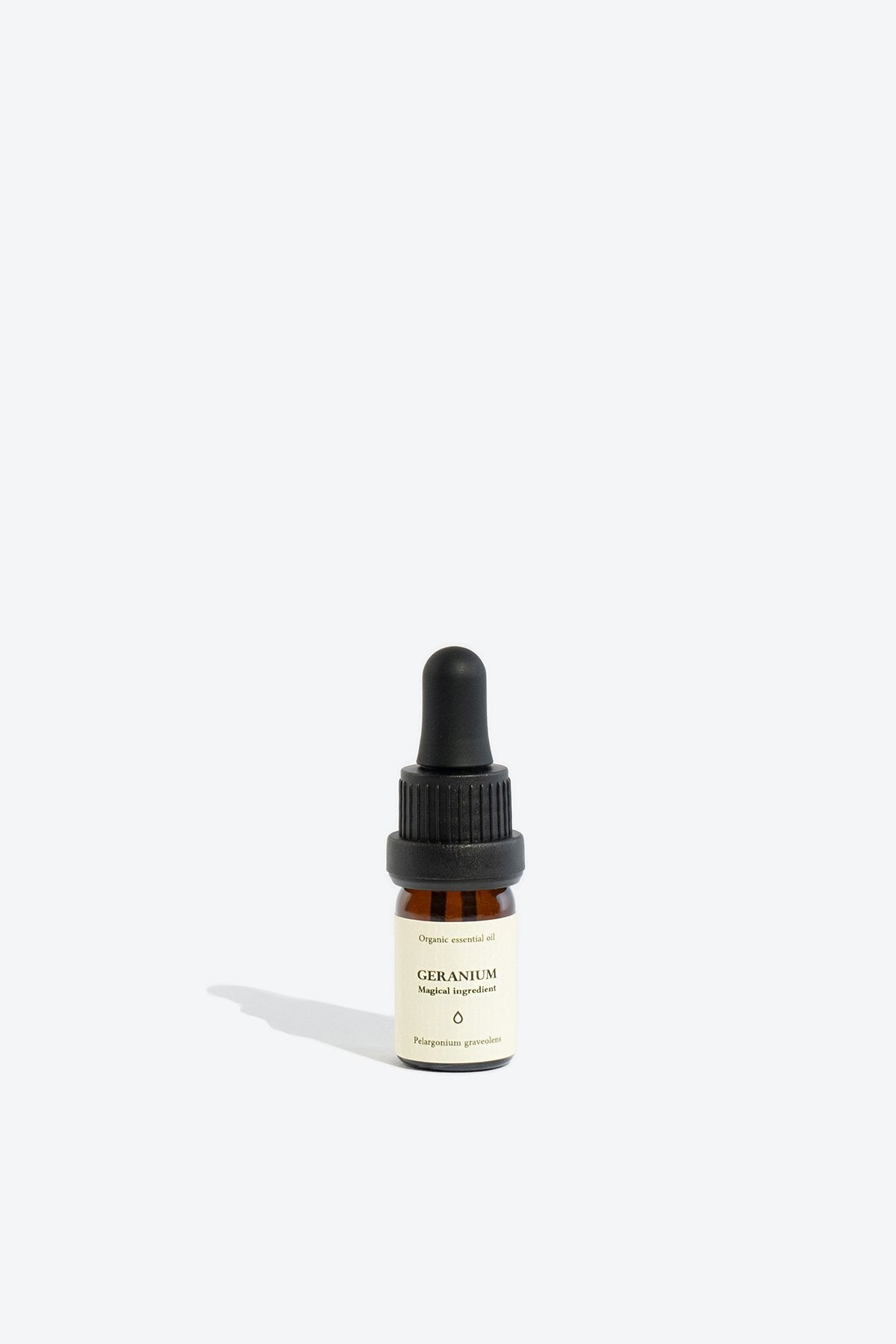 3. Smells Like Spells GERANIUM Essential Oil in 5 ml glass bottle, studio setting