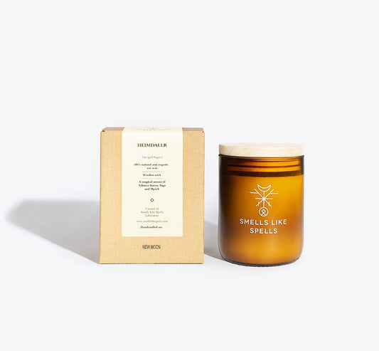 1. Smells Like Spells HEIMDALLR scented candle in amber glass jar with packaging, featuring wooden wick and mystical design