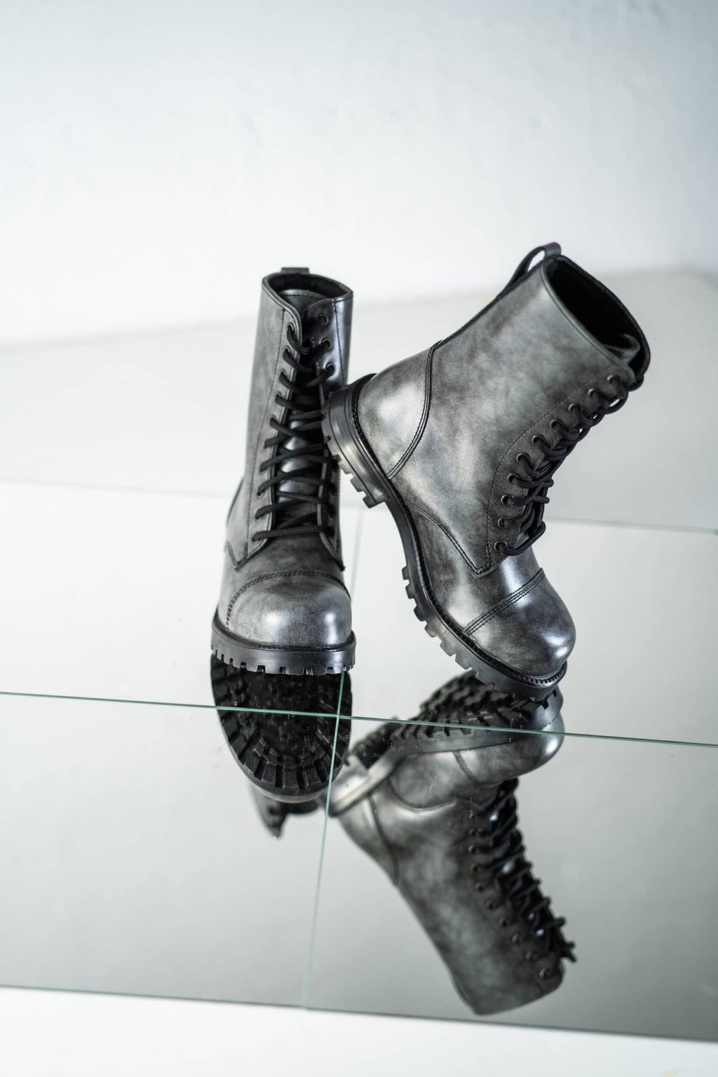 4. Reflective studio shot of Samelin 511 Gray boots emphasizing punk-style design and traction outsole