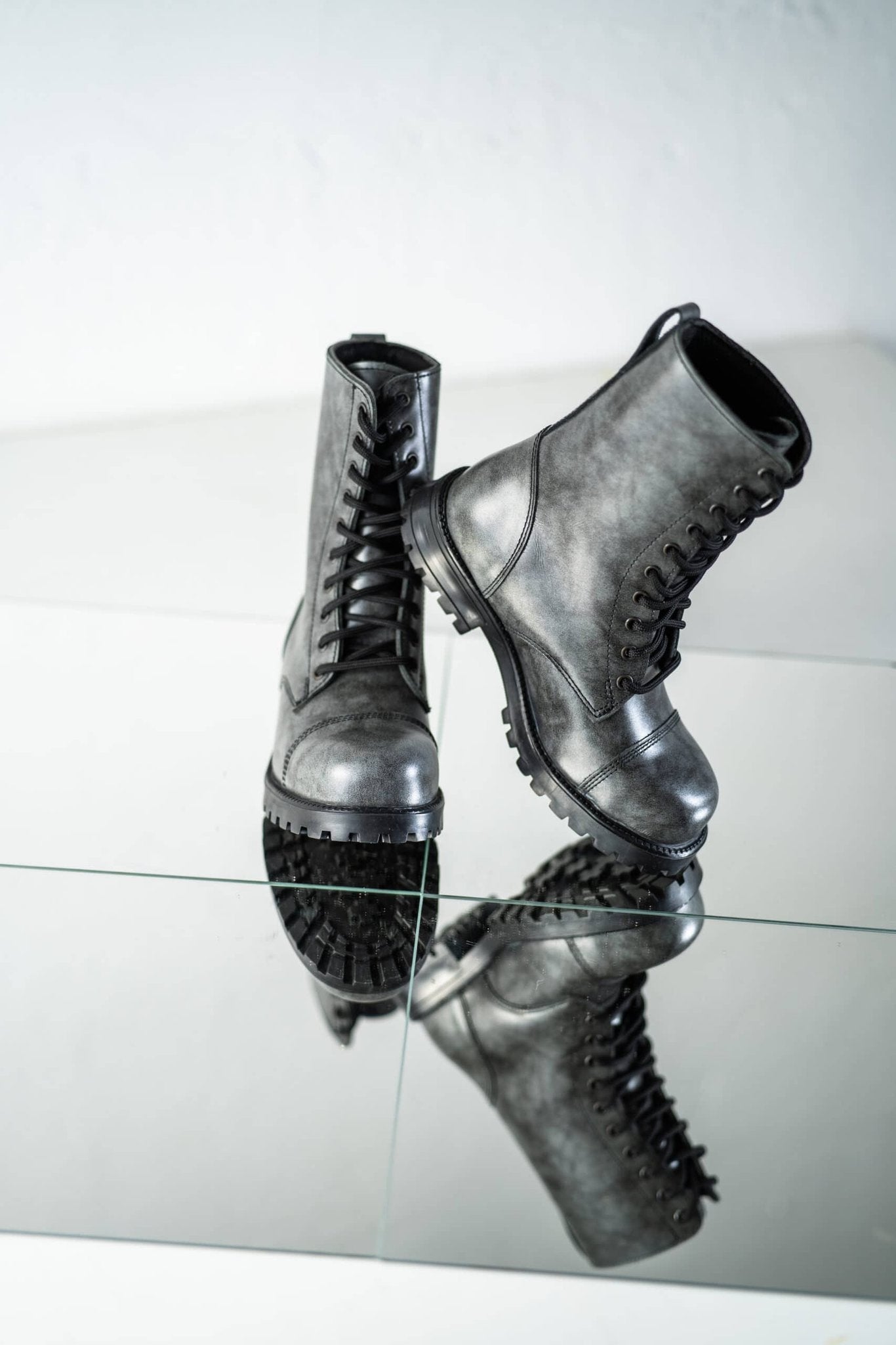 4. Reflective studio shot of Samelin 511 Gray boots emphasizing punk-style design and traction outsole
