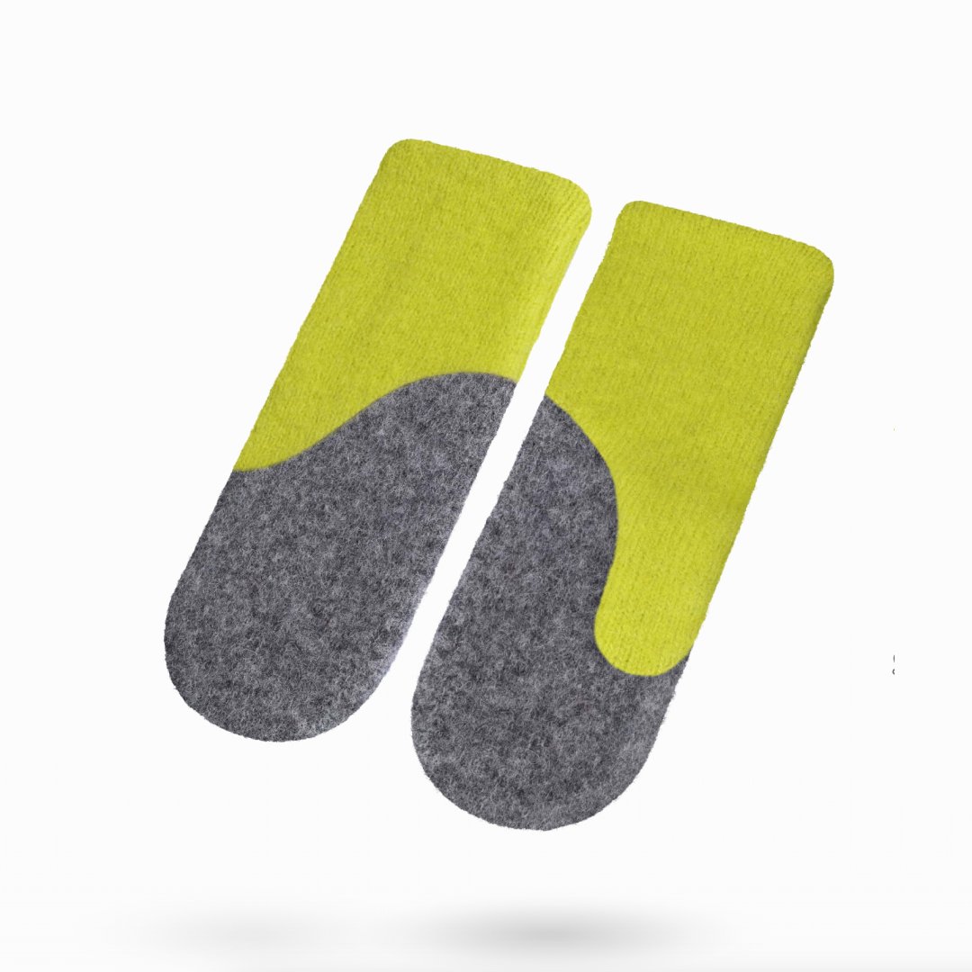1. Women's felted wool mittens in apple green and medium grey by HERTTA, shown in studio