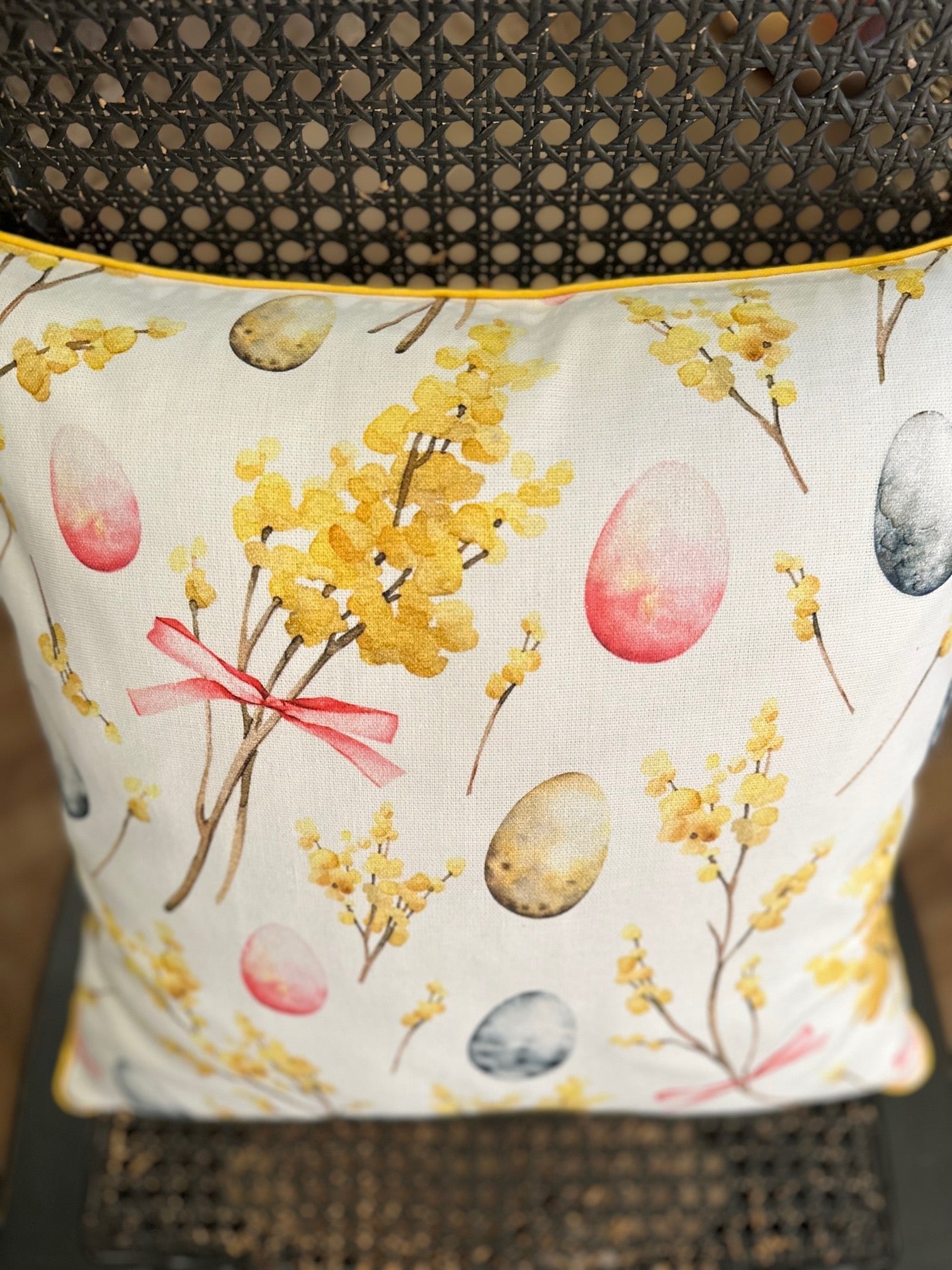 2. Close-up of Hortensias Home Easter Happy pillowcase, showcasing detailed Easter egg and floral print in vibrant colors on cotton material