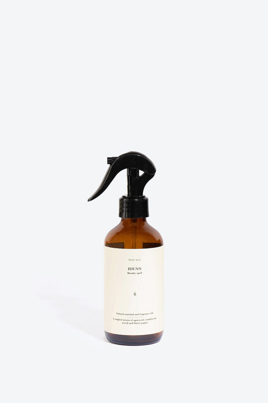 2. Smells Like Spells IDUNN home spray in amber bottle, studio shot