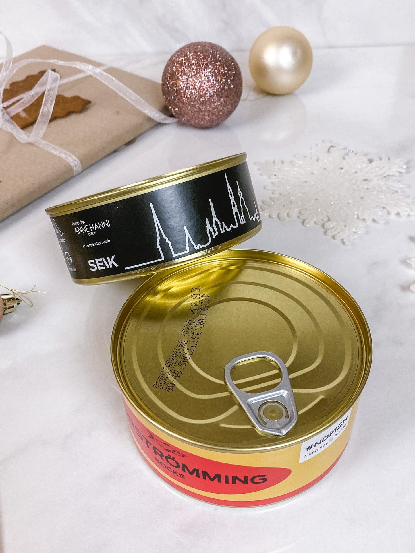 1. SEIK men's socks gift set in quirky tin can packaging, featuring Surströmming and Tallinn designs, perfect for gifting