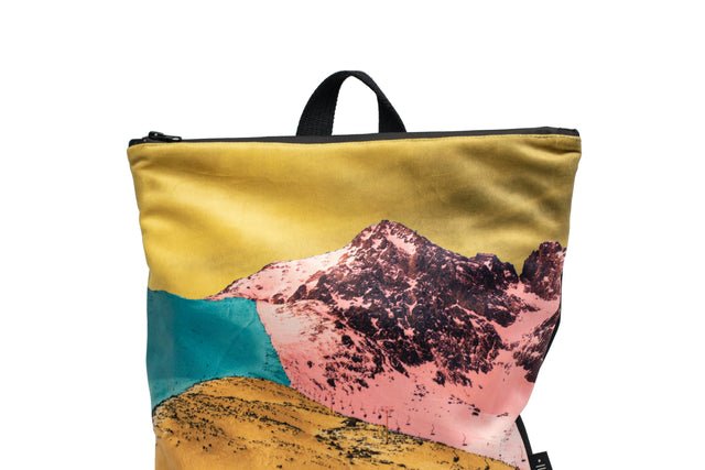 6. Close-up of Muni Bold Mountains backpack top with mountain print